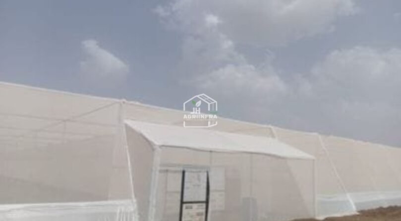 Flat Roof Shade Net House Flat roof agricultural shade net house in India built by JH Agriinfra, used for protected farming and nursery cultivation