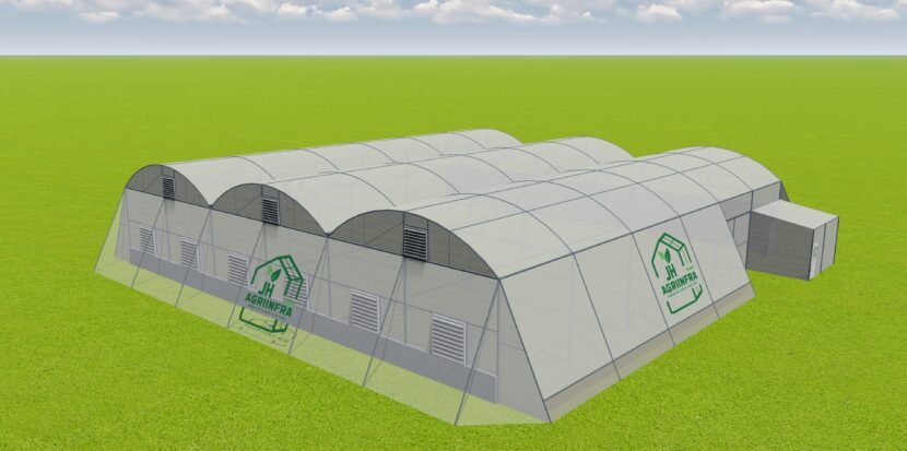 Fan and pad controlled polyhouse structure by JH Agriinfra with advanced climate control for sustainable crop production.